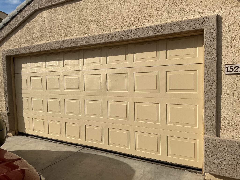 New garage door installed on home in Arizona HOA community in compliance with HOA rules